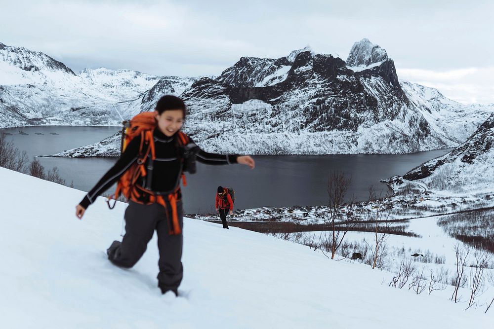 Backpackers hiking up  Segla mountain, Norway