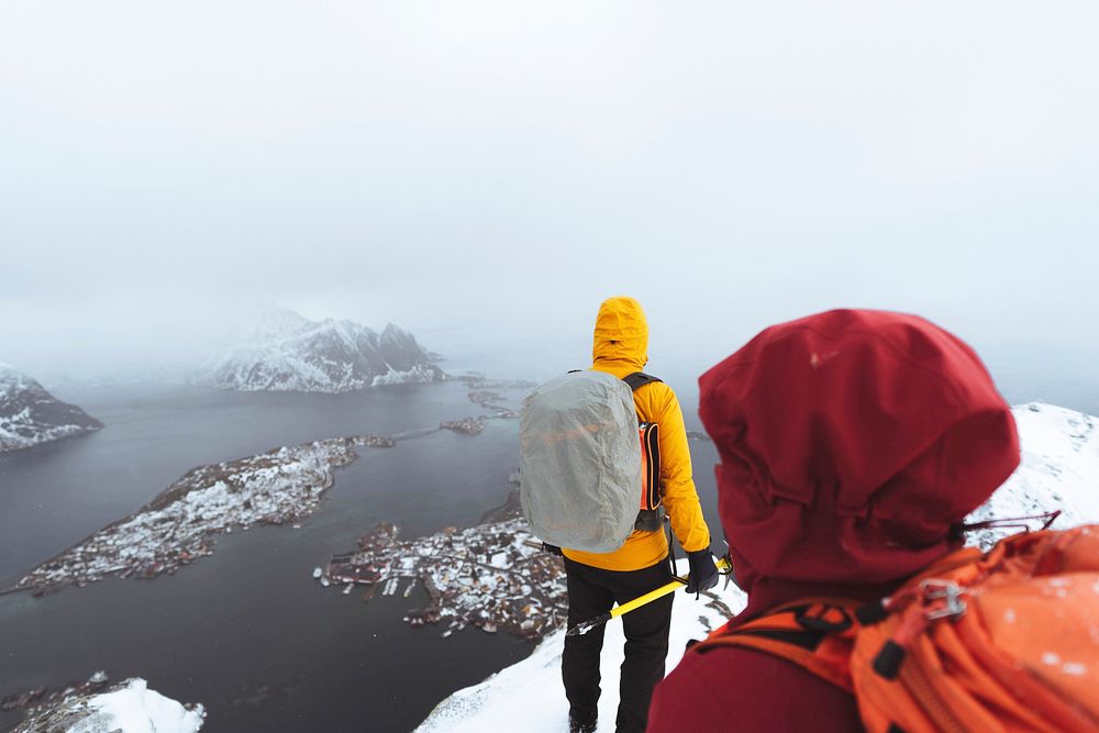 Backpackers hiking Reinebringen in the Lofoten Islands, Norway