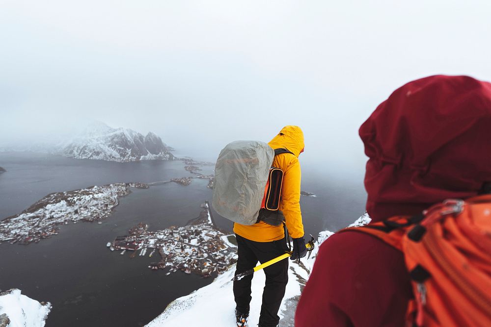 Hikers up in Reinebringen in the Lofoten Islands, Norway