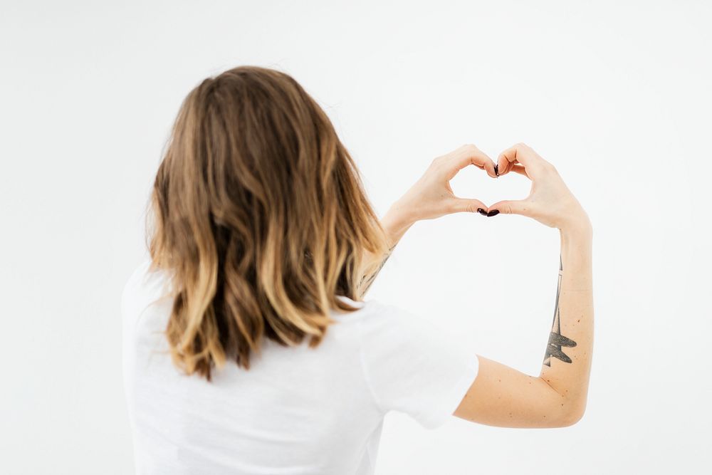 Woman forming a heart with her hands 