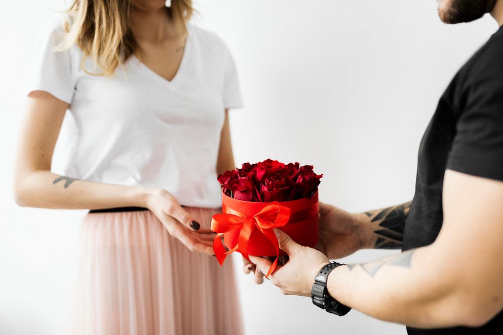 Boyfriend surprising his girlfriend with roses 