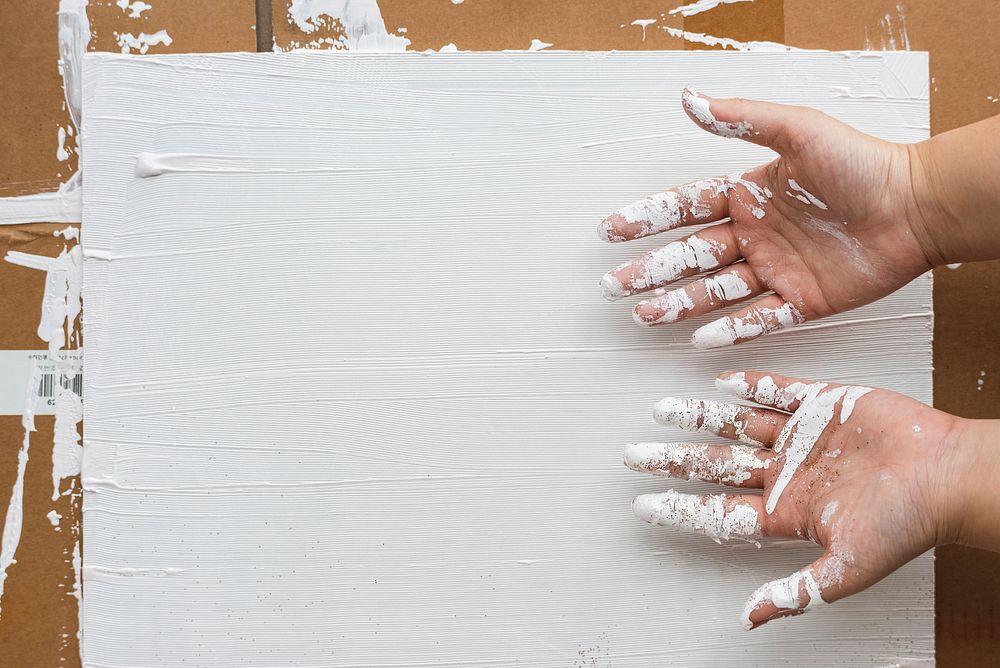 White color stained on an artist hands 