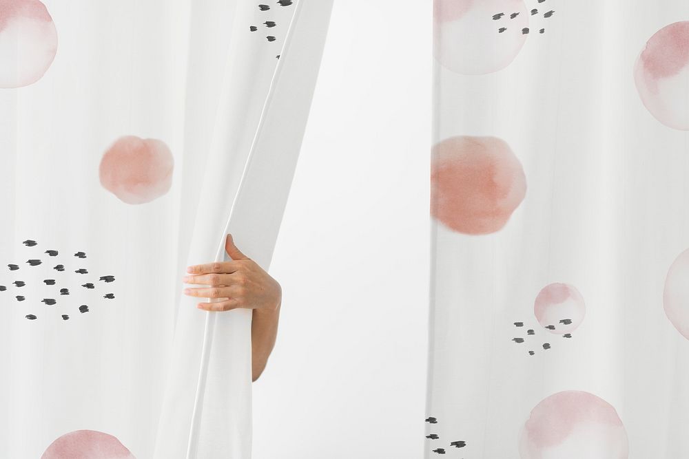 Hand opening a patterned curtain mockup