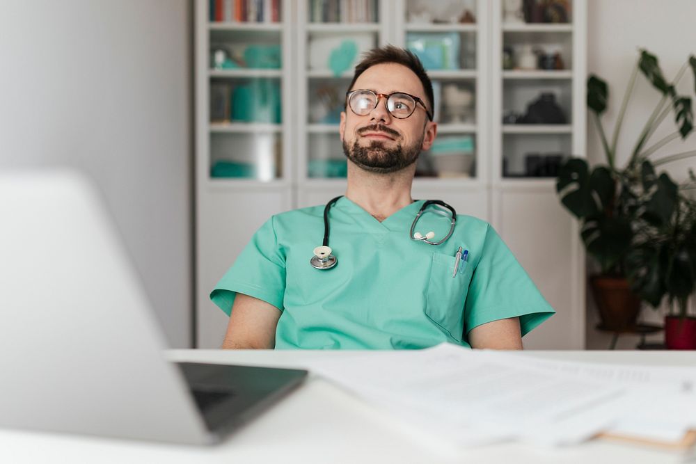 Doctor sitting in his office at the hospital