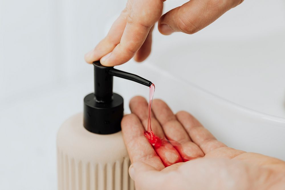 Man using a soap dispenser