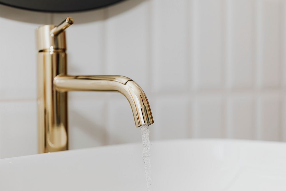 Golden faucet with running water 