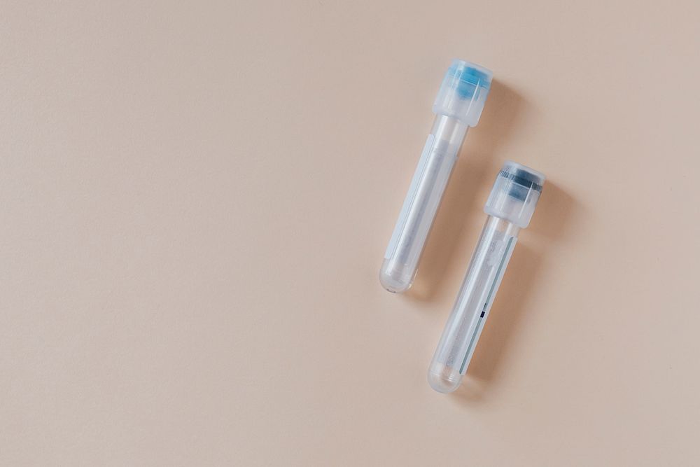 Empty test tubes on a beige background