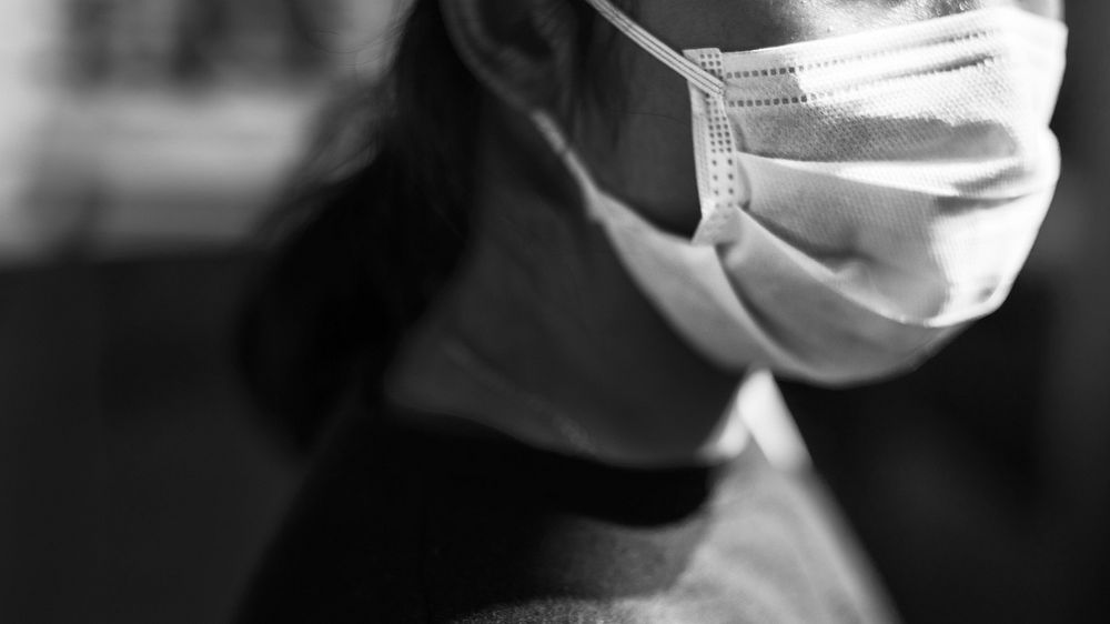 Woman wearing a face mask in public to prevent coronavirus infection