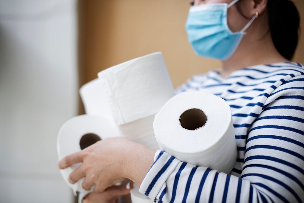 Woman hoarding toilet paper 