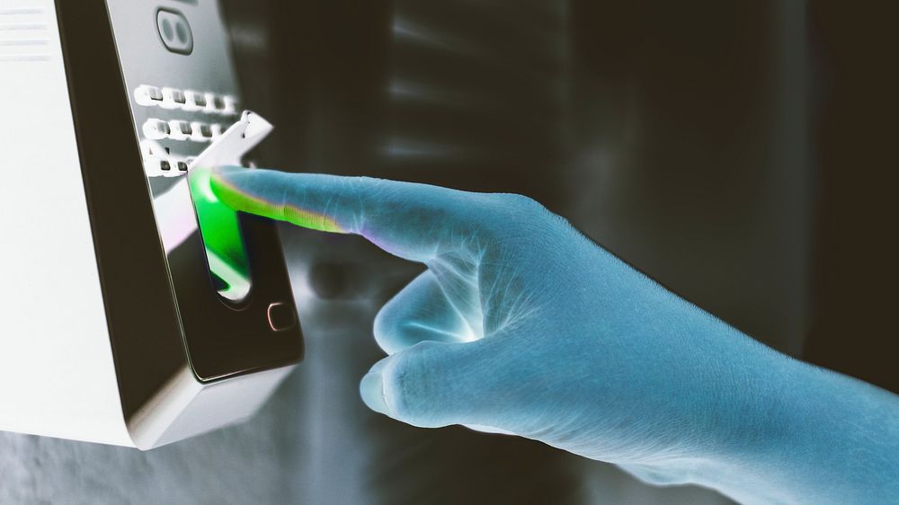 Scanning finger on a coronavirus contaminated fingerprint access control