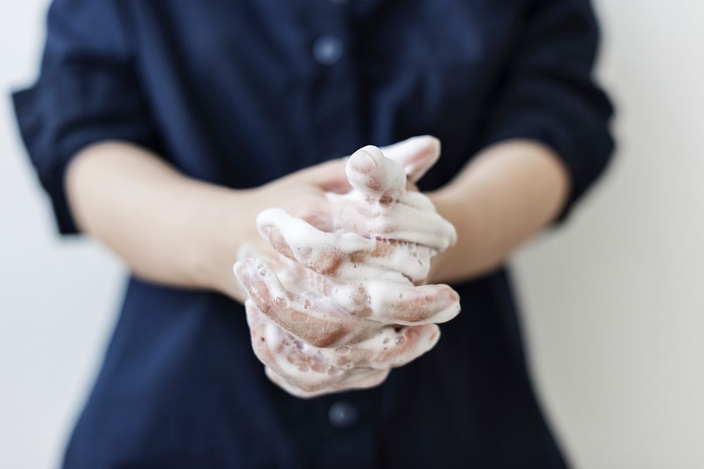 Washing hands with soap to prevent coronavirus contamination