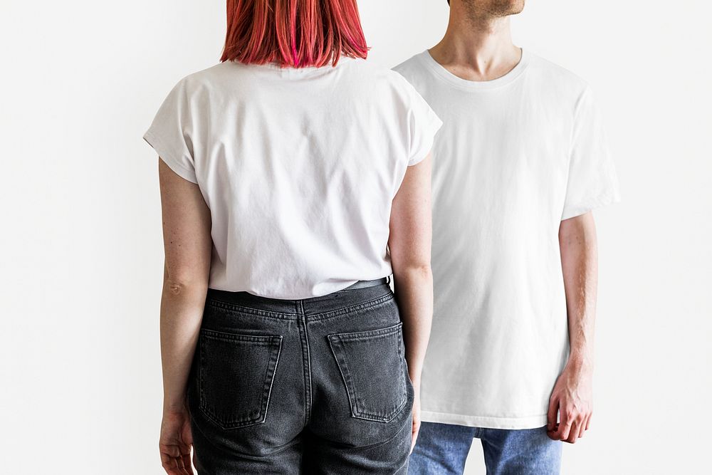 Man and woman in white t-shirt jeans studio shot