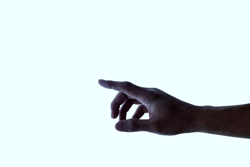Finger touching an interactive white digital presentation screen