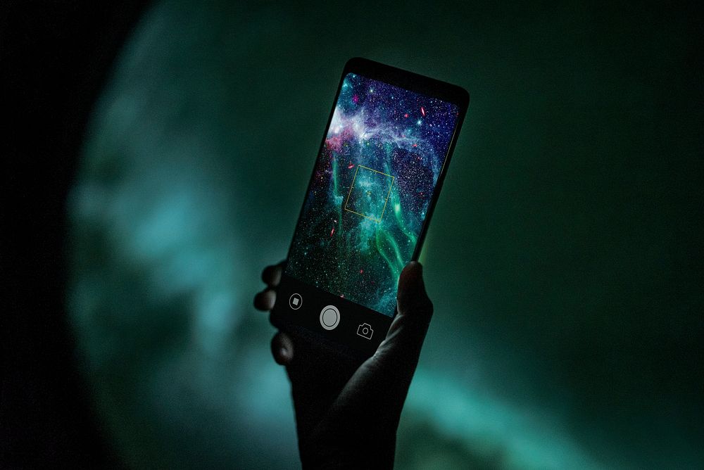 Smartphone screen mockup at the planetarium psd