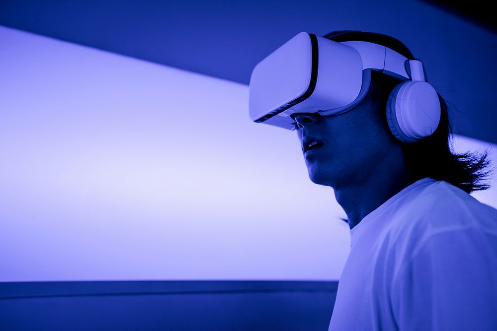Man experiencing metaverse, wearing VR headset in operational base
