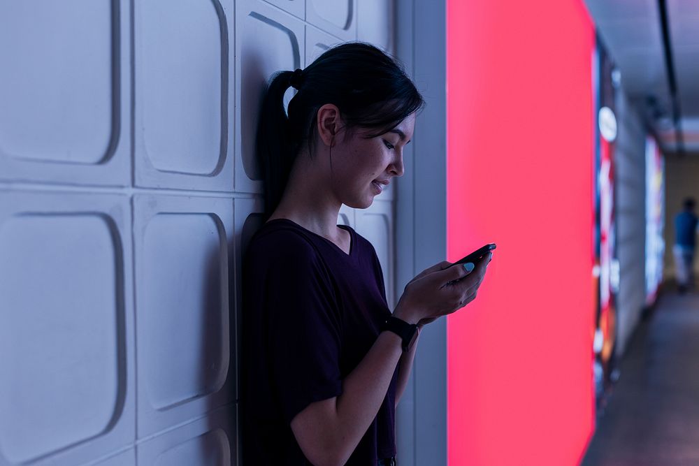 Girl on her phone at a shopping mall