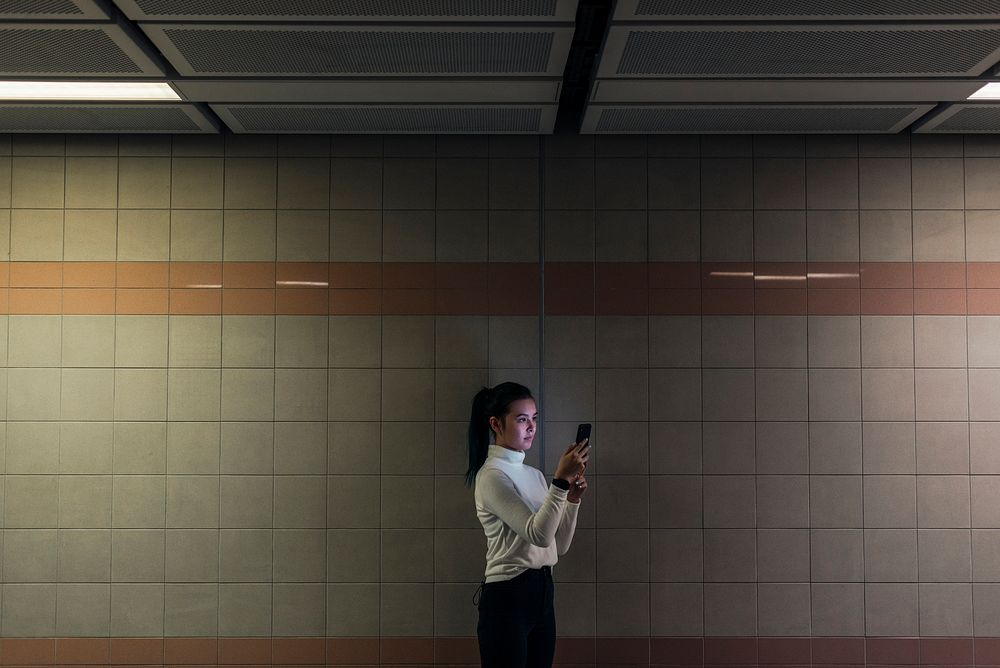 Girl waiting alone at the underground subway station