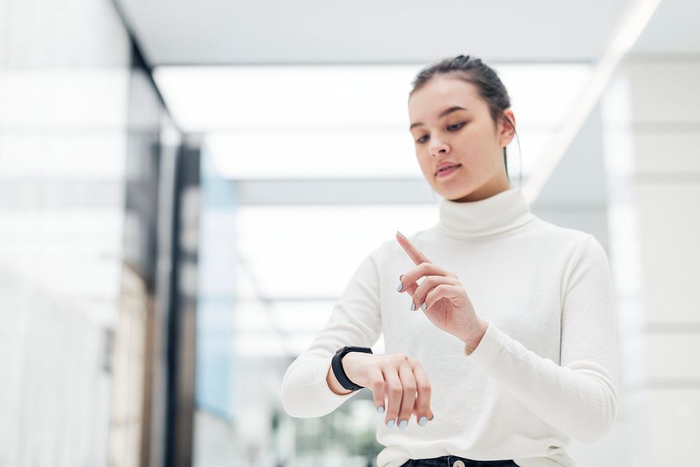 Asian girl wearing smartwatch technology of the future