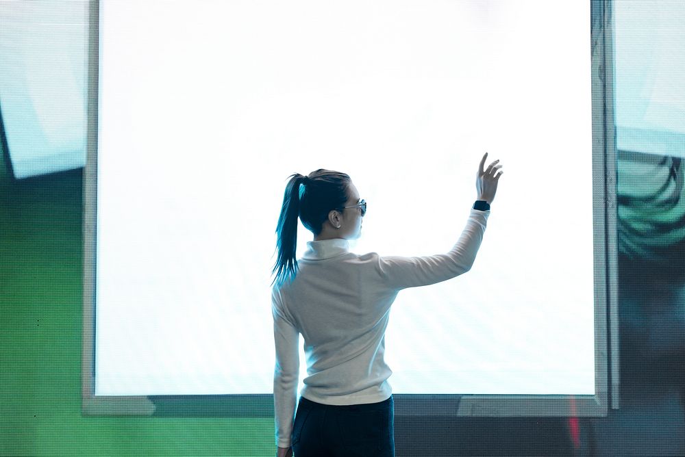 Student presenting a report on a large screen