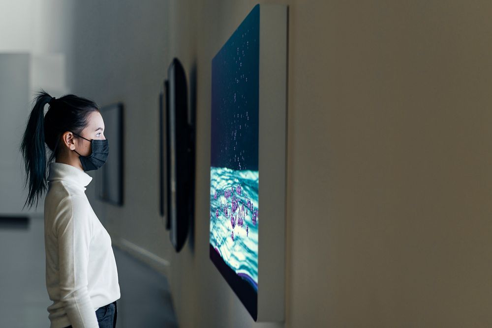 Girl by an interactive artwork at a gallery