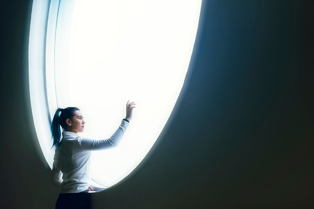 Girl using touch screen in a modern smart home