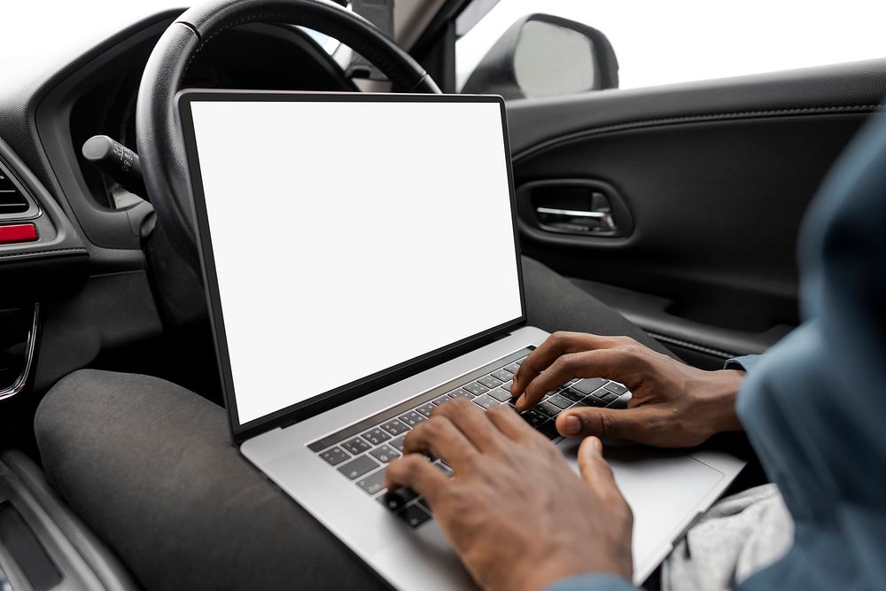 Laptop screen mockup in a new self driving car psd