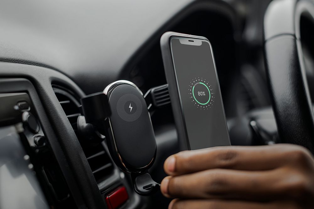 Phone screen mockup on wireless charger in car
