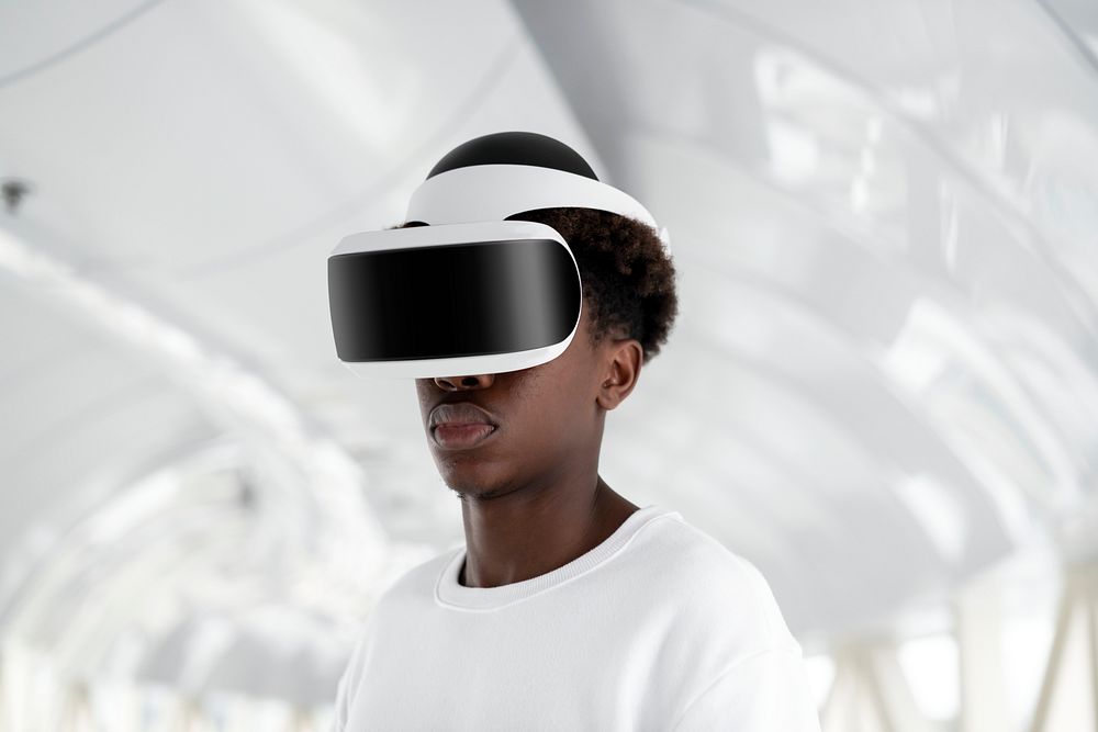 Man wearing a VR headset in a white tunnel futuristic technology