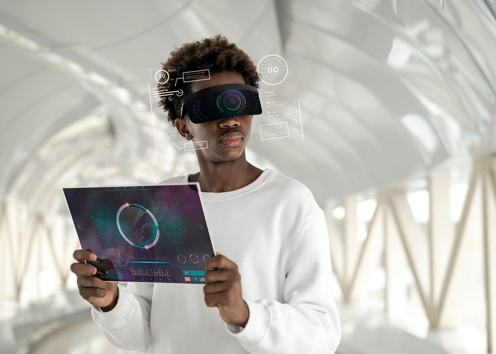 Man wearing smart glasses mockup using a transparent tablet mockup futuristic technology