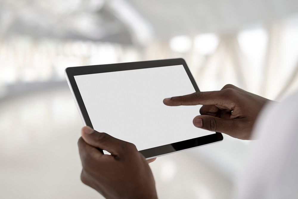 Digital tablet screen mockup psd in the hands of a man