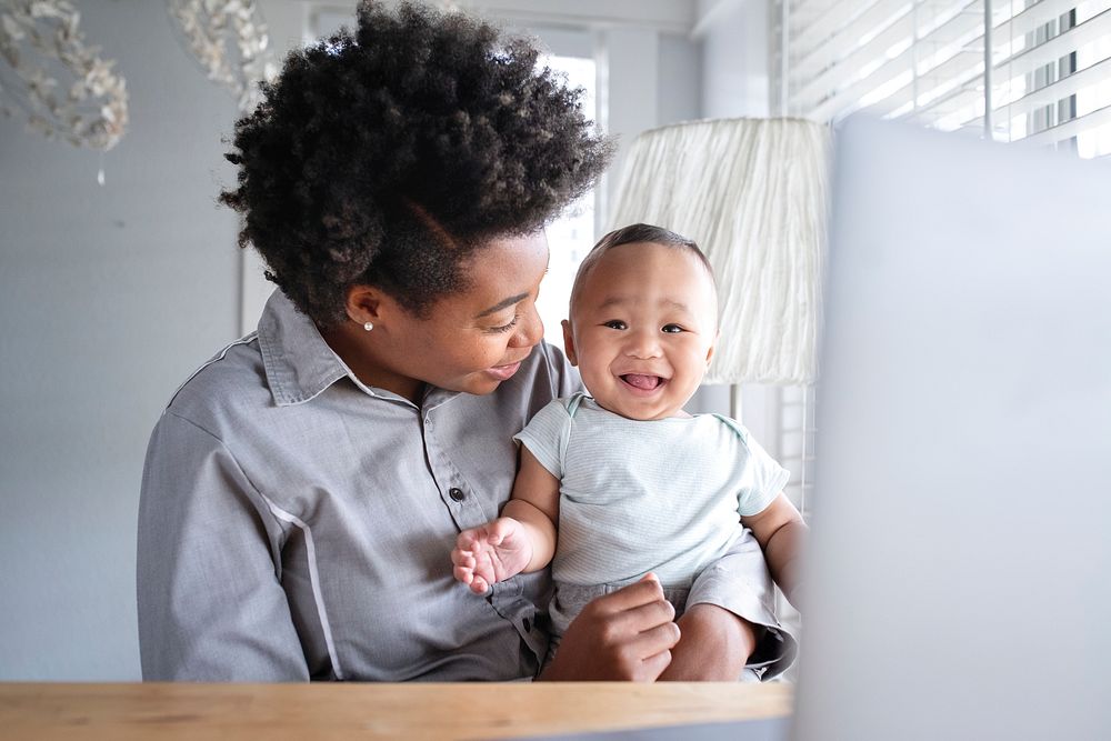 Single mom consulting with a telemedicine doctor online from her home