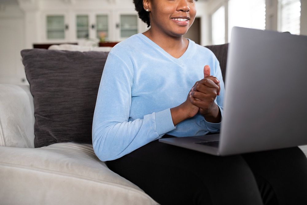 African American woman working from home on a laptop during covid19