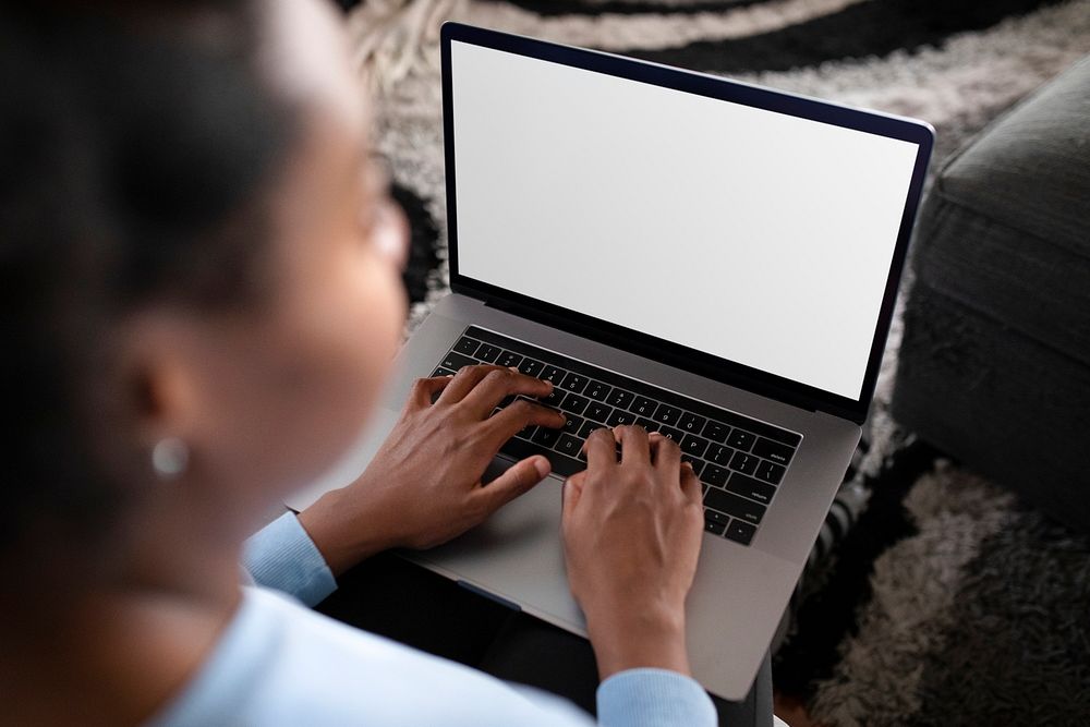 African American woman working from home on a laptop mockup 