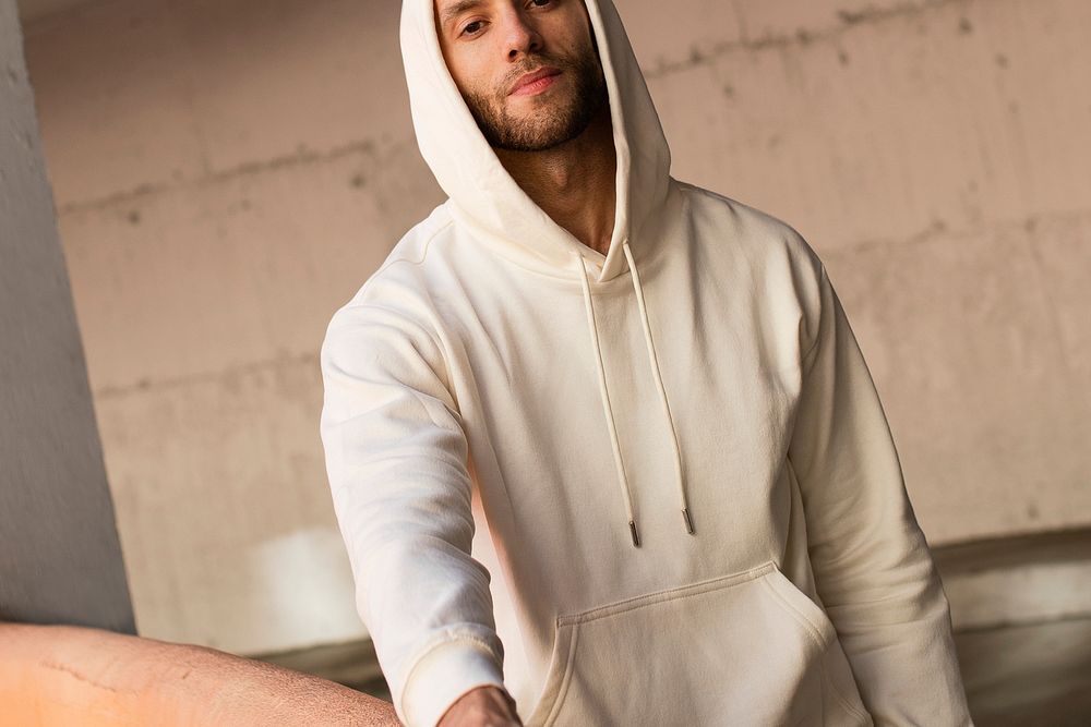 Man in beige hoodie menswear fashion