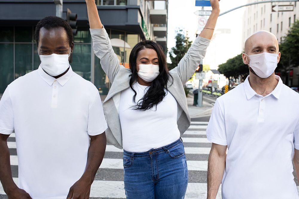 New normal lifestyle group of friends wearing mask hanging out in the city