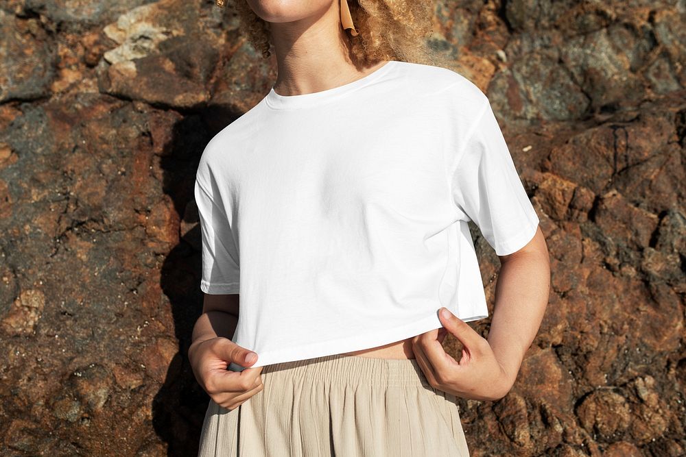 Women&rsquo;s white crop top psd mockup beach apparel photoshoot