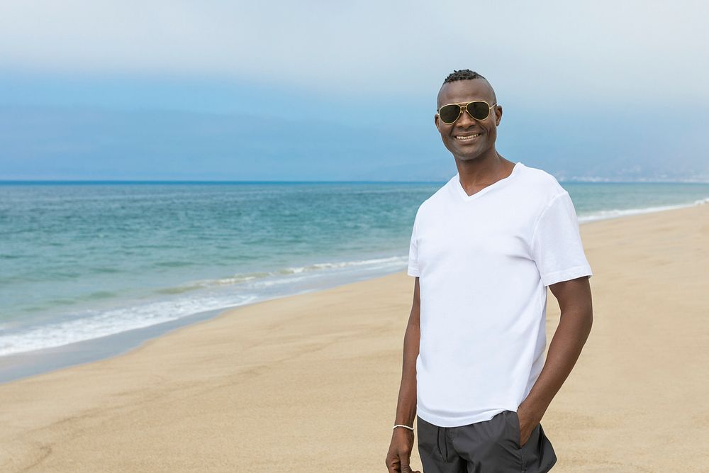 African American man in white tee at the beach
