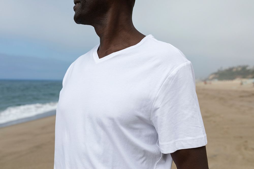 African American man in white tee at the beach close up