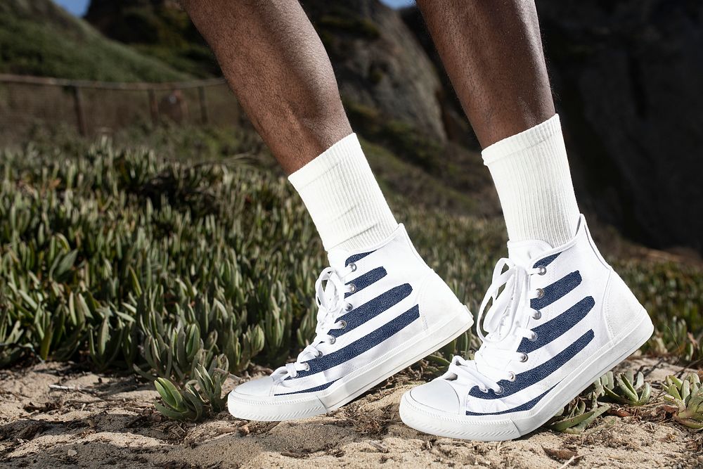 White ankle sneakers mockup psd with stripes closeup men&rsquo;s apparel outdoor shoot