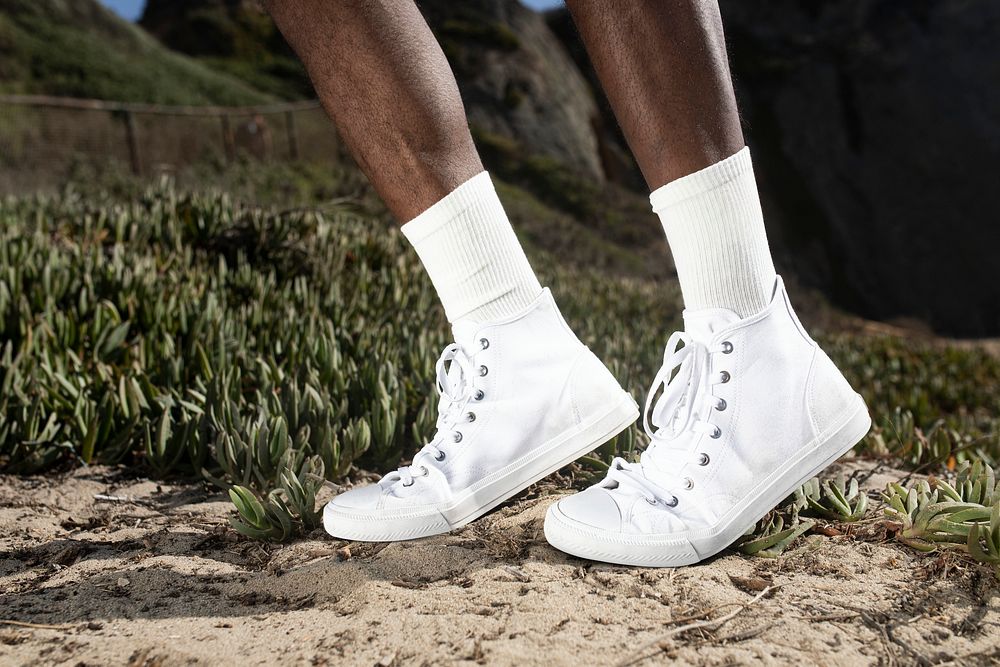 Plain white ankle sneakers closeup men&rsquo;s apparel outdoor shoot