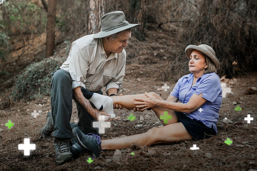 Retired couple psd husband bandaging his wife’s ankle 