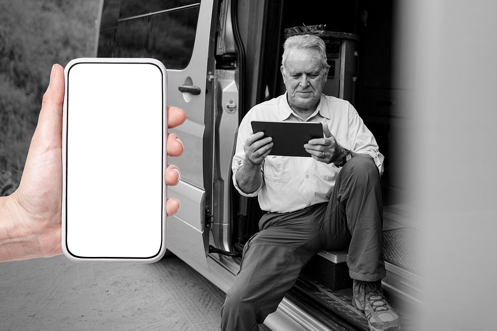 Smartphone white screen mockup psd with grandpa sitting on camper van