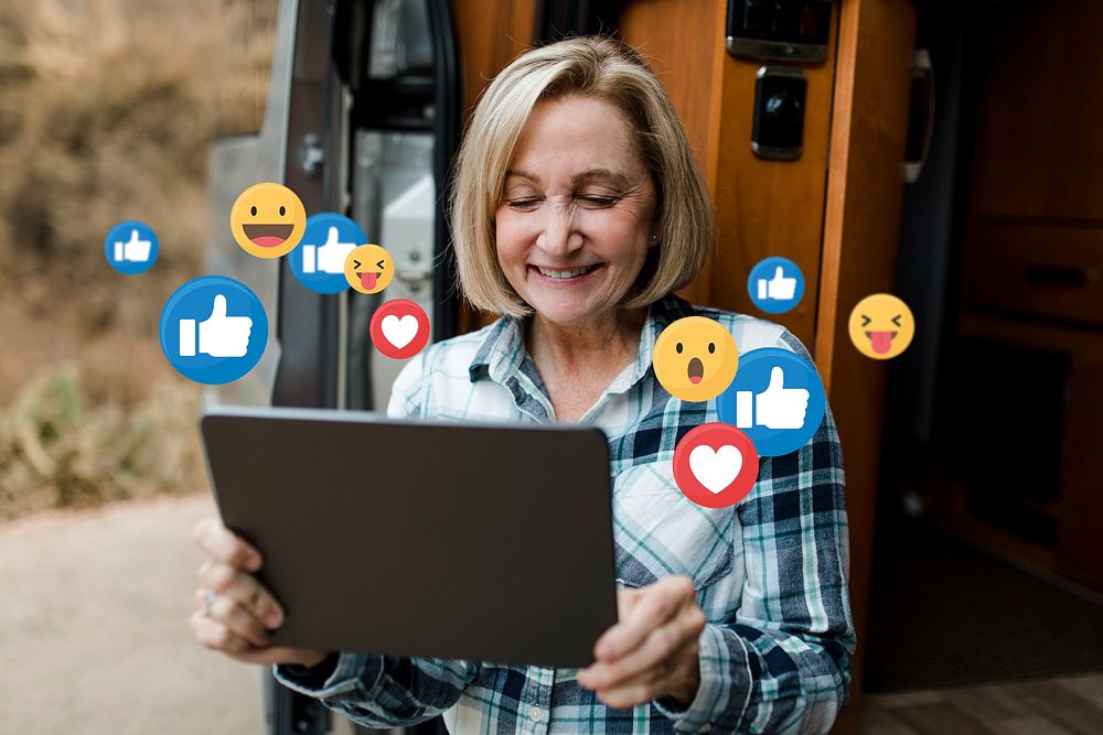 Senior woman enjoying social media browsing on tablet