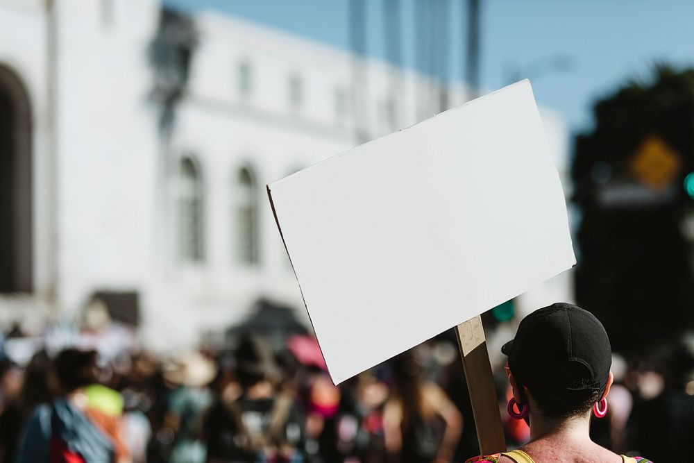 Woman holding a blank white board at a black lives matter protest