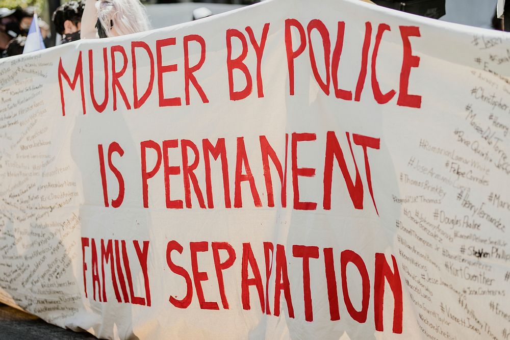 Murder by police is permanent family separation banner at a Black Lives Matter protest outside the Hall of Justice in…