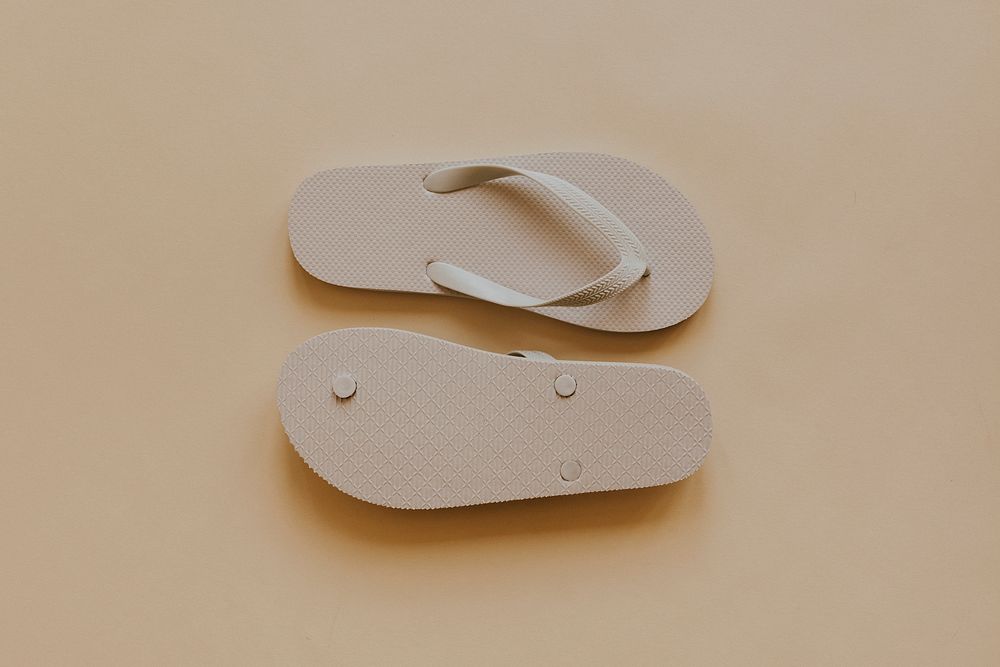 Off white flip flop slipper on beige