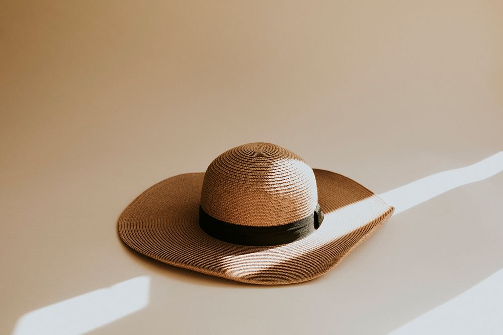 Straw sun hat with brown ribbon