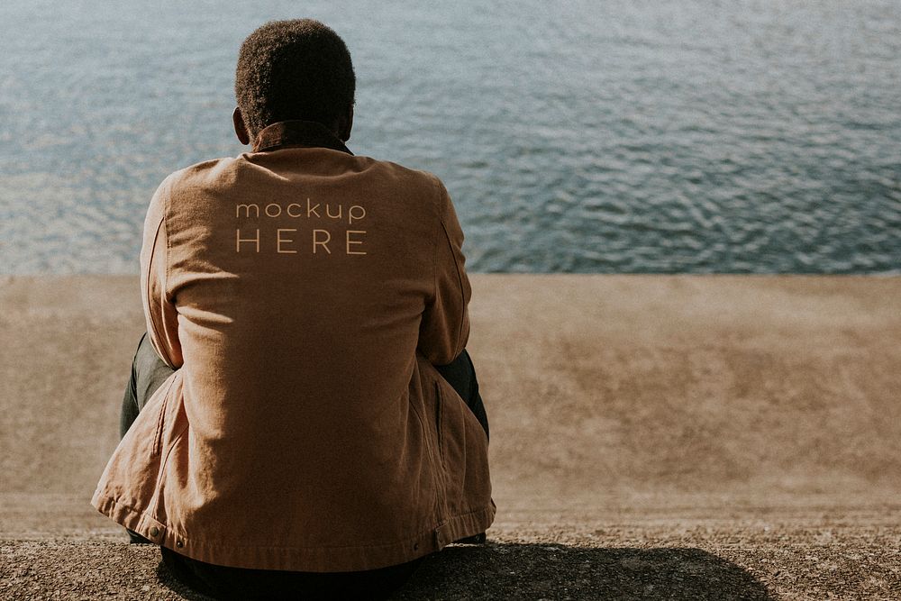 Brown jacket mockup back view psd by the lake
