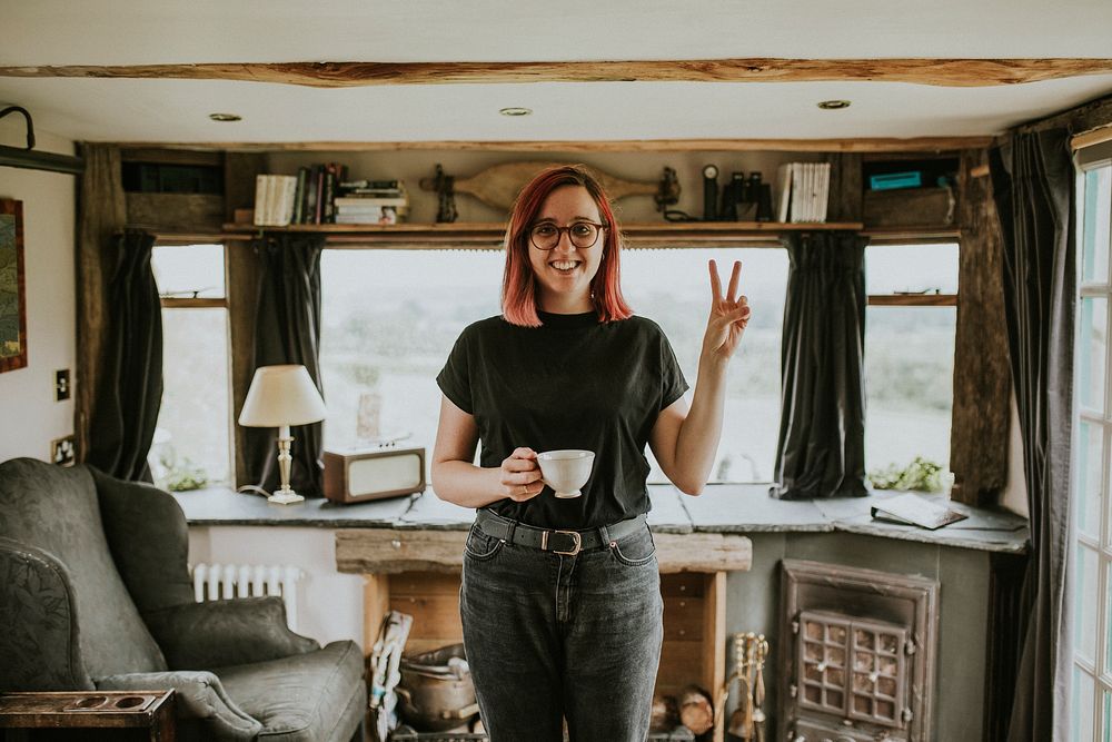 Woman with a coffee cup mockup in a cabin