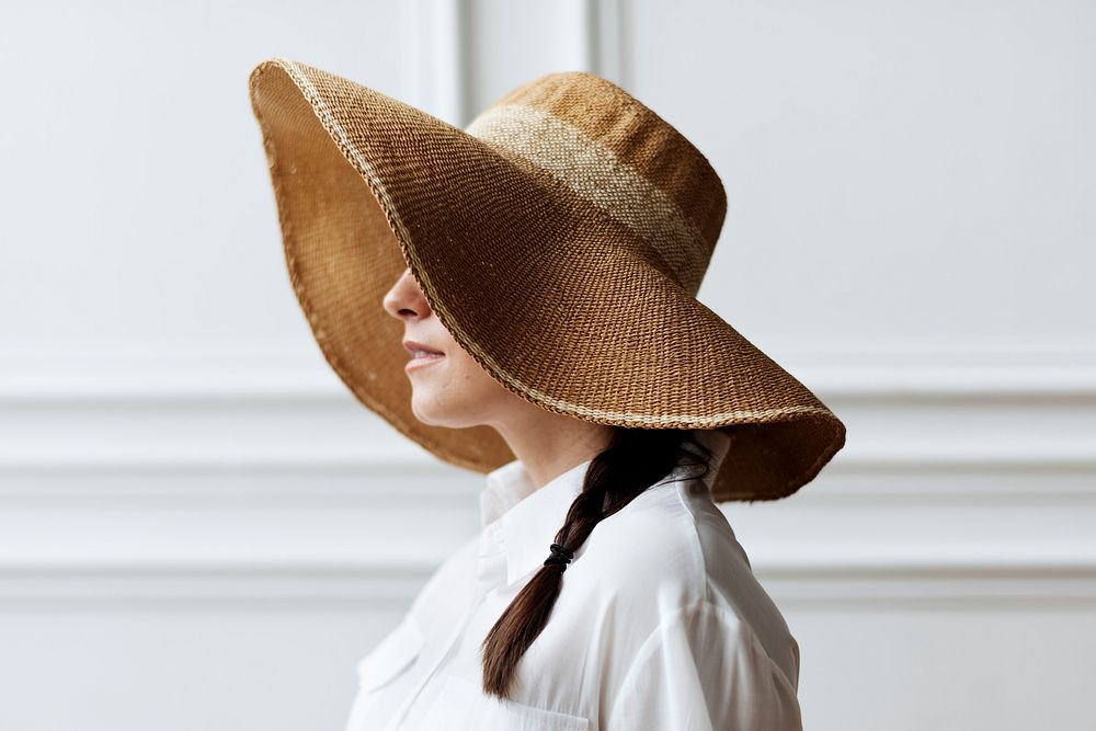 Woman in a vintage wide brim summer hat